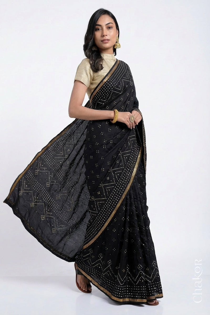 Model wearing Black Bandhani Mulberry Silk Saree with sequins embroidery.