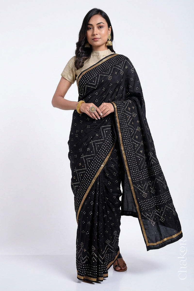 Model wearing Black Bandhani Mulberry Silk Saree with sequins embroidery.