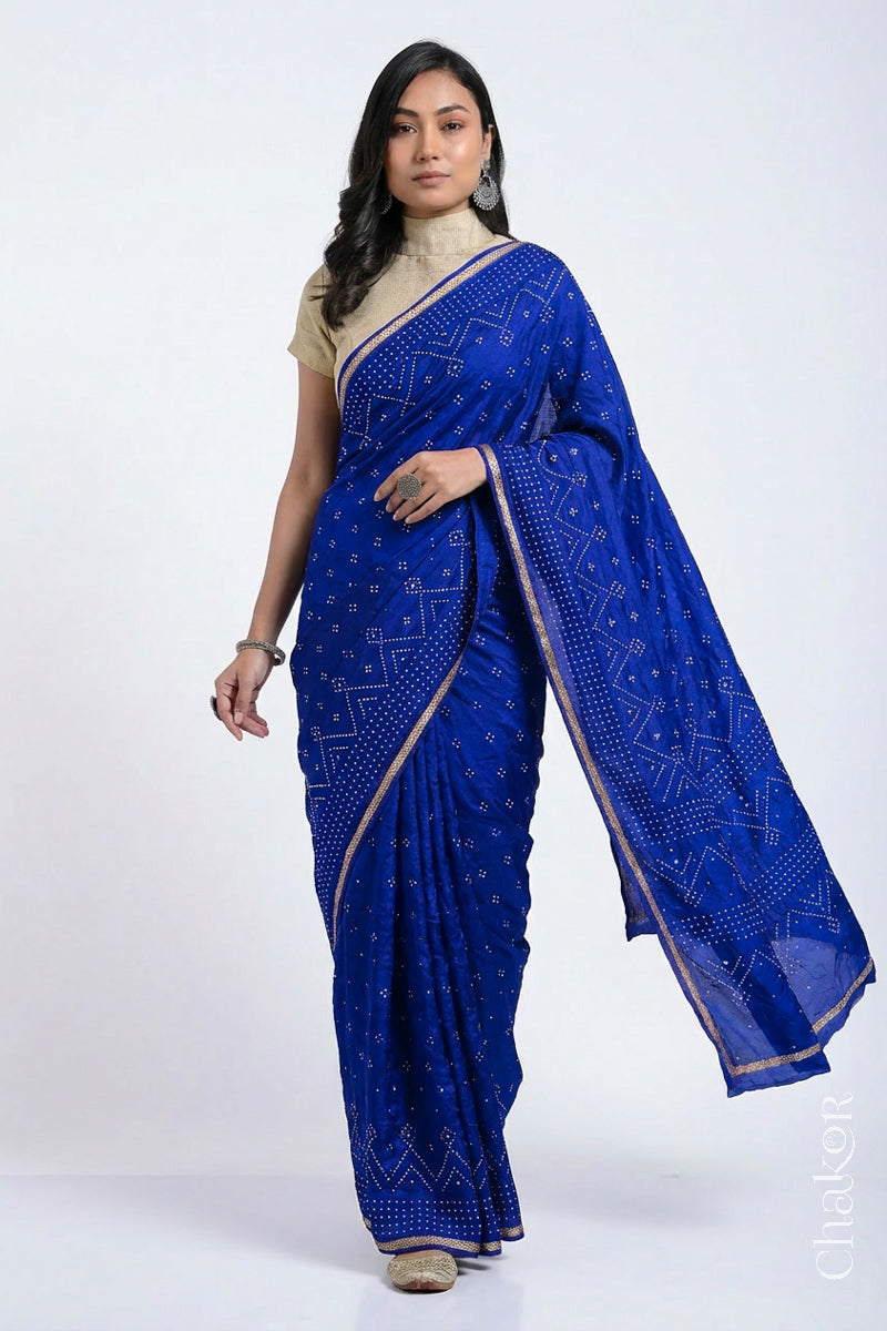 Model wearing Blue Bandhani Mulberry Silk Saree with sequins embroidery.
