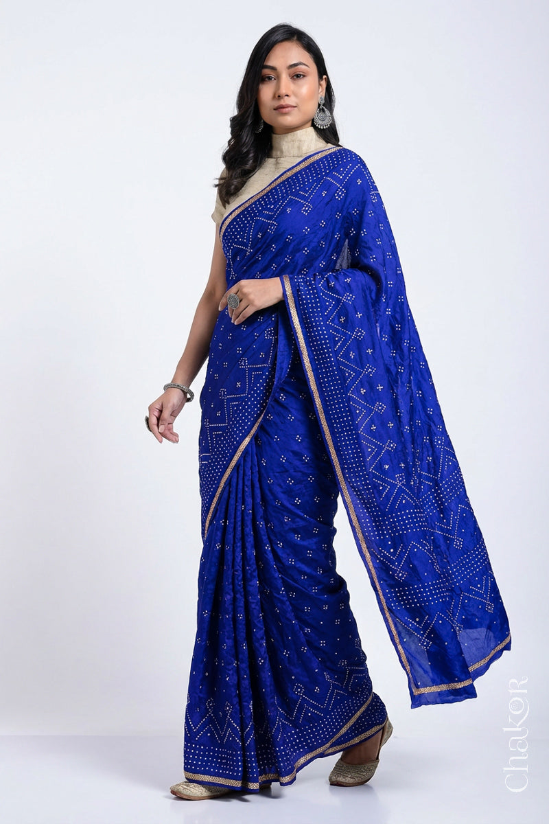 Model wearing Blue Bandhani Mulberry Silk Saree with sequins embroidery.