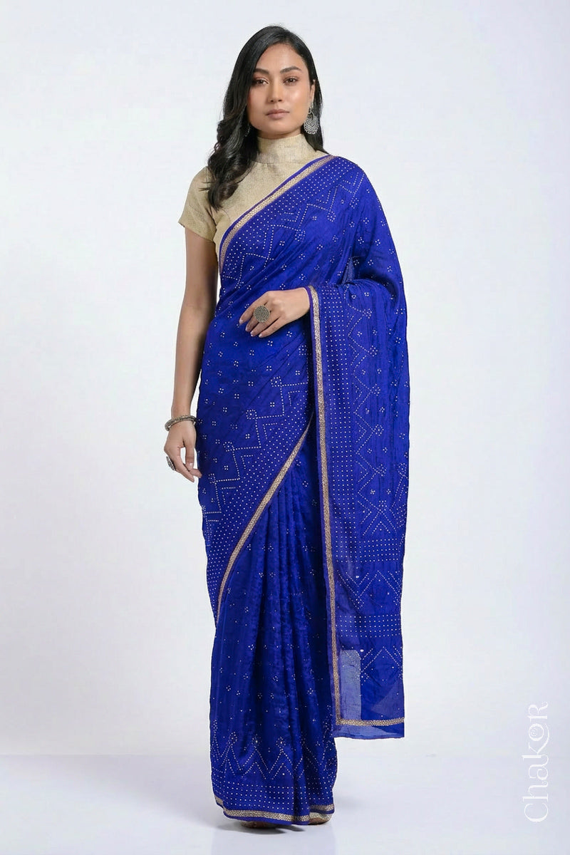 Model wearing Blue Bandhani Mulberry Silk Saree with sequins embroidery.