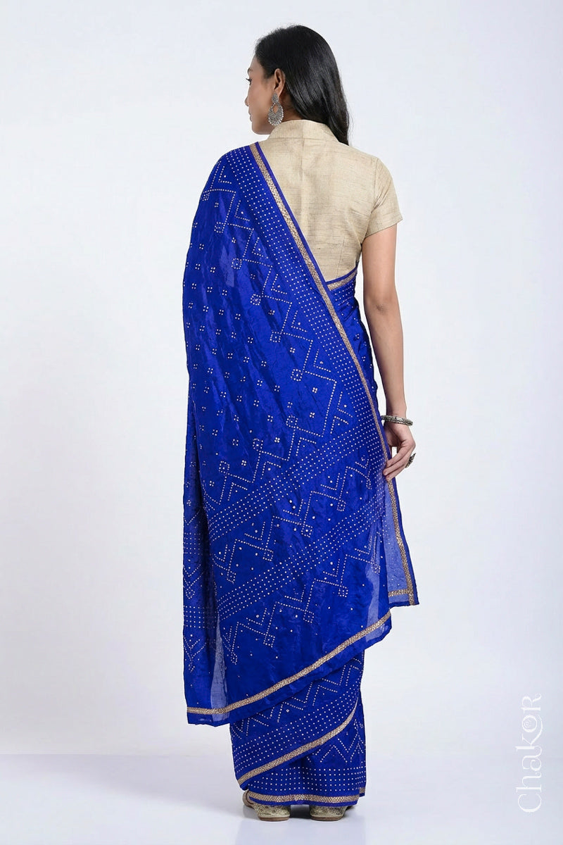 Back View of model wearing Blue Bandhani Mulberry Silk Saree with sequins embroidery.