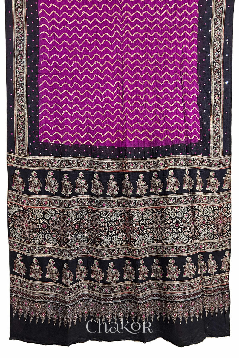 Full view of Magenta Bandhani Saree with Black Ajrakh printed border and pallu in pure gaji silk with traditional bandhej tie-dye & mirror work, handcrafted in Kutch. 