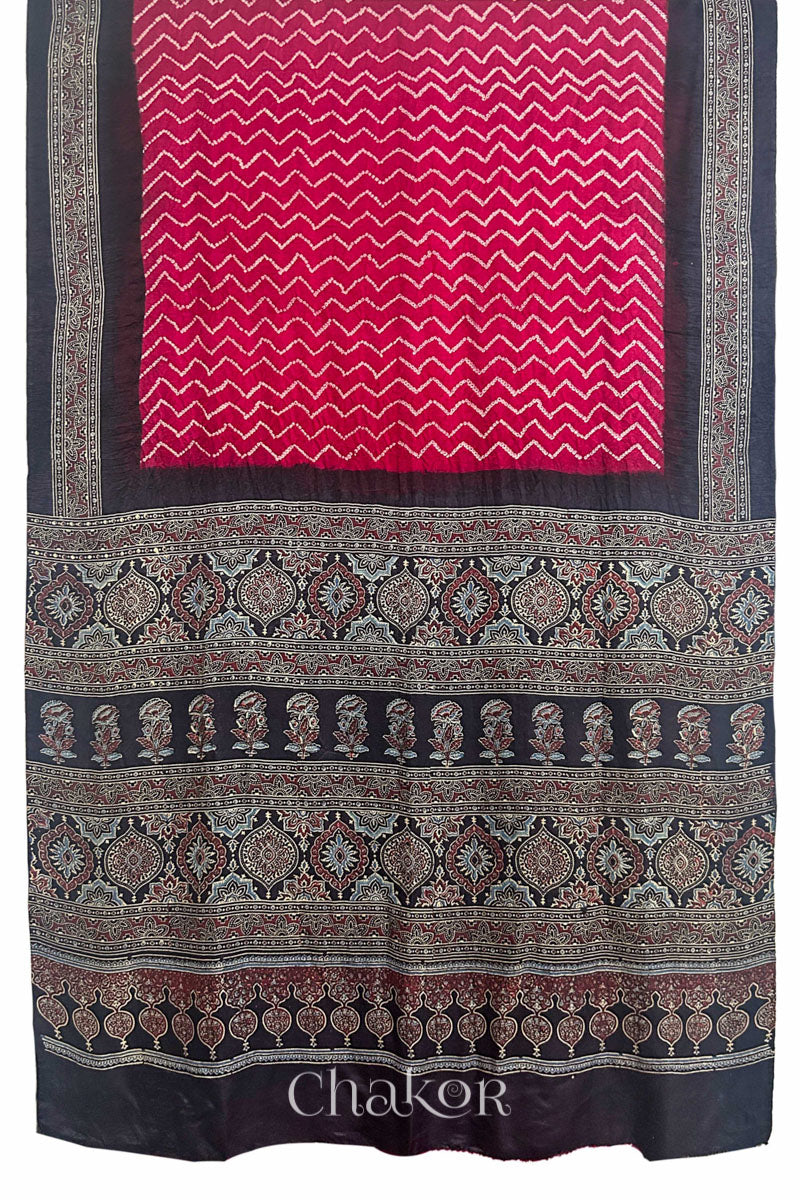 Full view of Red Bandhani Saree with Black Ajrakh printed border and pallu in pure gaji silk with traditional bandhej tie-dye, handcrafted in Kutch. 