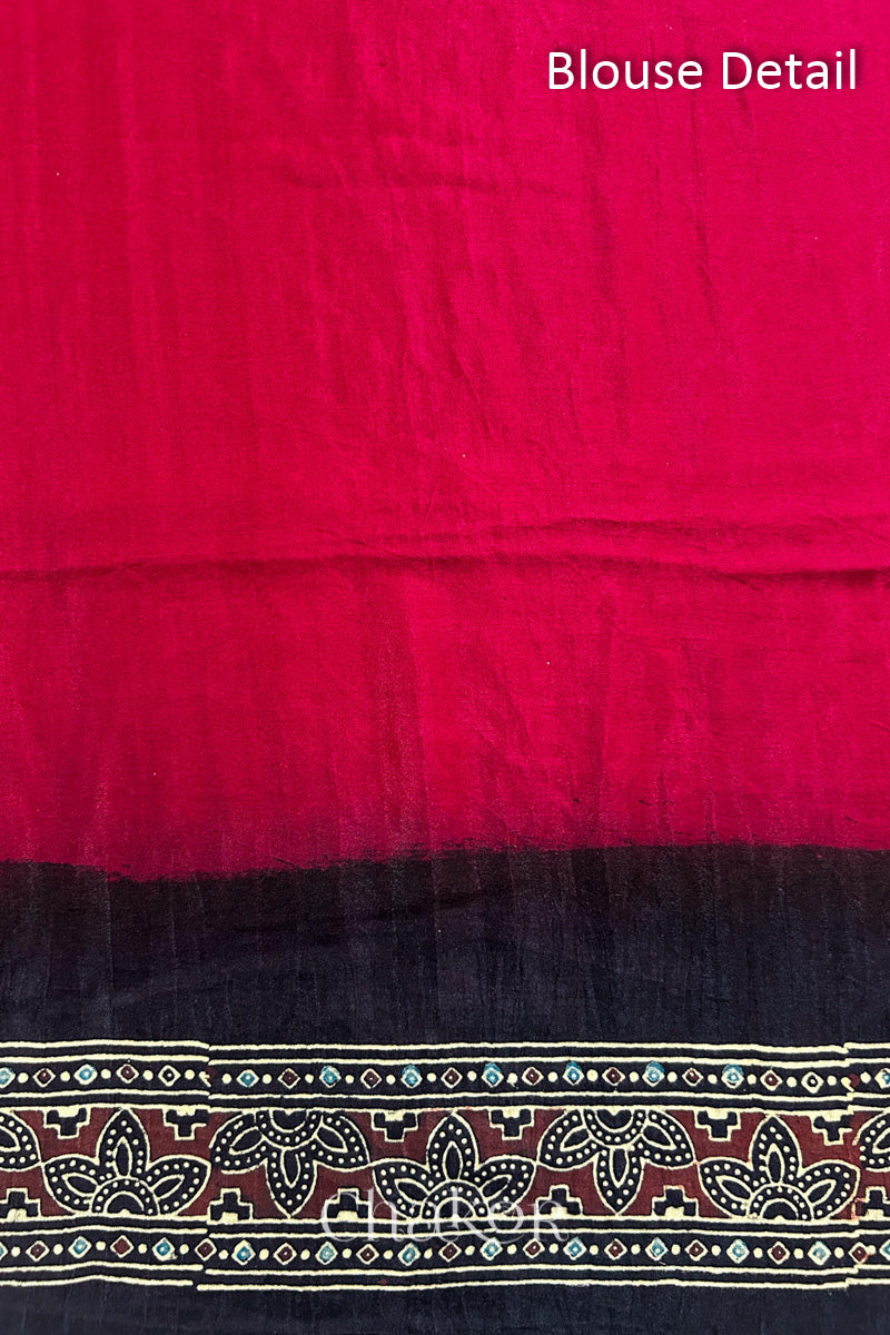 Close up of Red Bandhani Saree with Black Ajrakh printed border and pallu in pure gaji silk with traditional bandhej tie-dye, handcrafted in Kutch. 