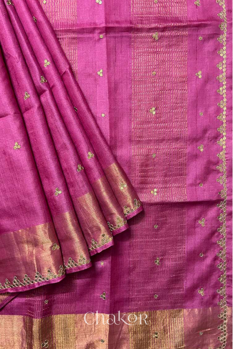 Close up of Pink tussar silk handloom saree with golden zari border & hand embroidered with  sequins & zari work
