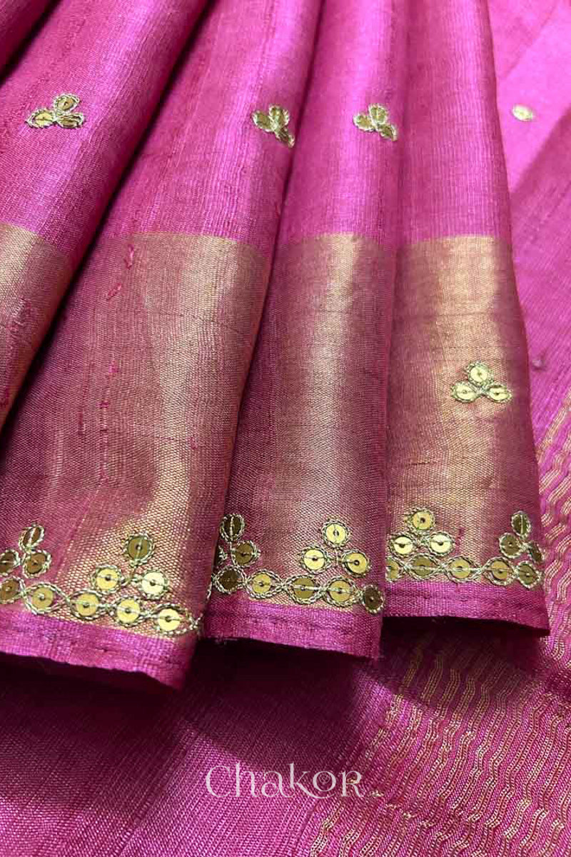 Close up of Pink tussar silk handloom saree with golden zari border & hand embroidered with  sequins & zari work