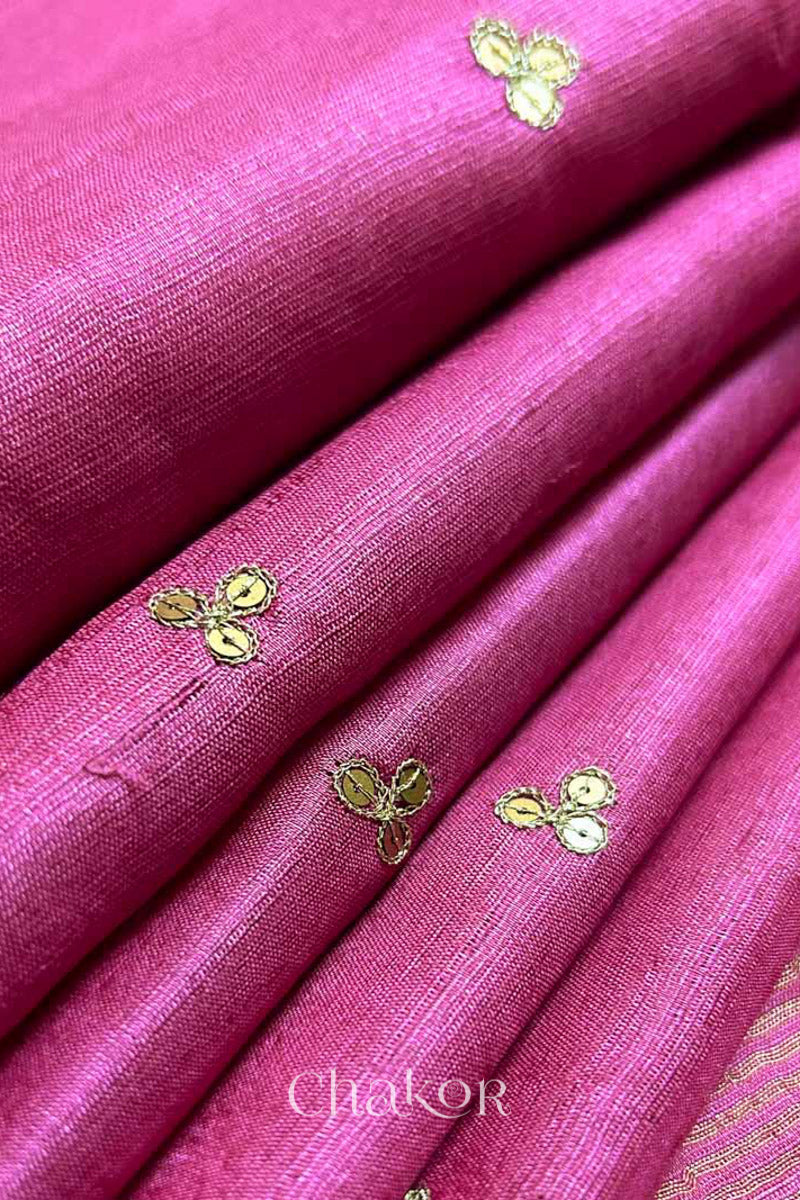 Close up of Pink tussar silk handloom saree with golden zari border & hand embroidered with  sequins & zari work