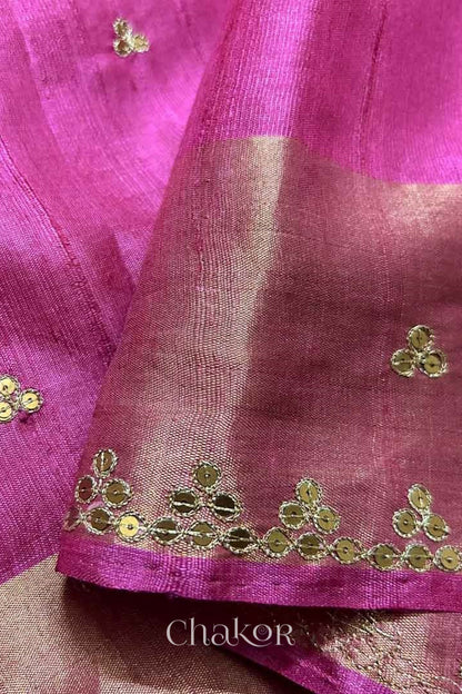Close up of Pink tussar silk handloom saree with golden zari border & hand embroidered with  sequins & zari work