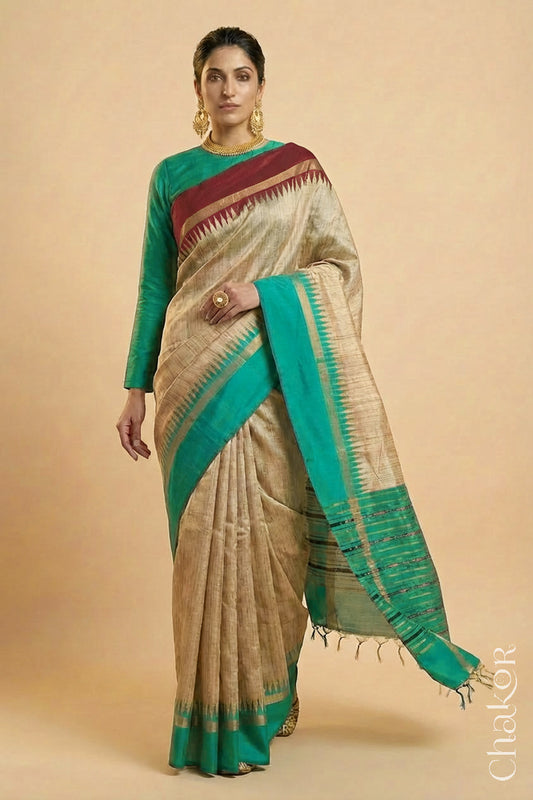 Woman wearing a traditional Jade Green and Natural tussar silk handloom temple border saree