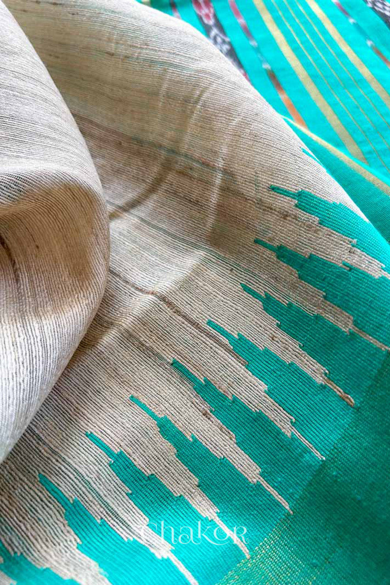 close up of a traditional Jade Green and Natural tussar silk handloom temple border saree