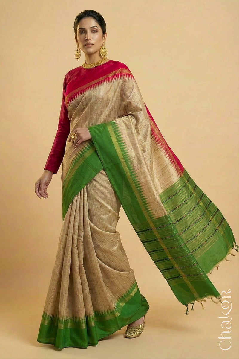 Woman wearing a traditional Green and Natural tussar silk handloom saree
