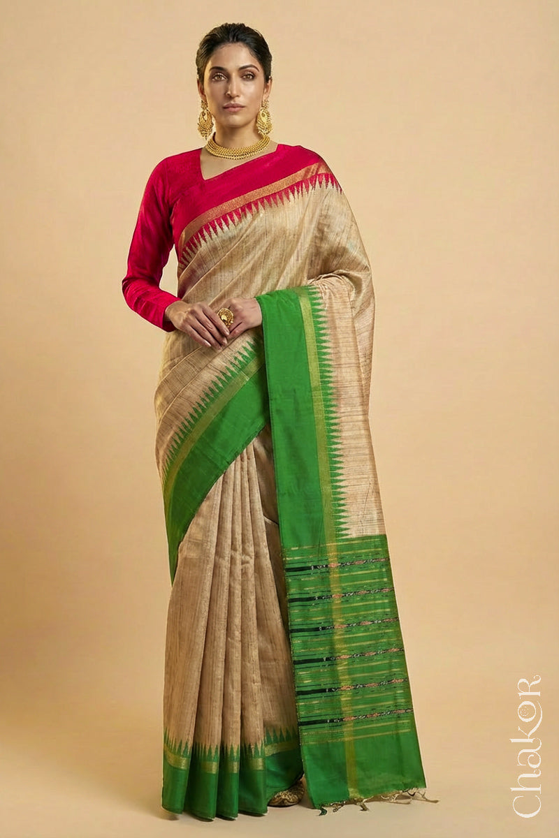 Woman wearing a traditional Green and Natural tussar silk handloom saree