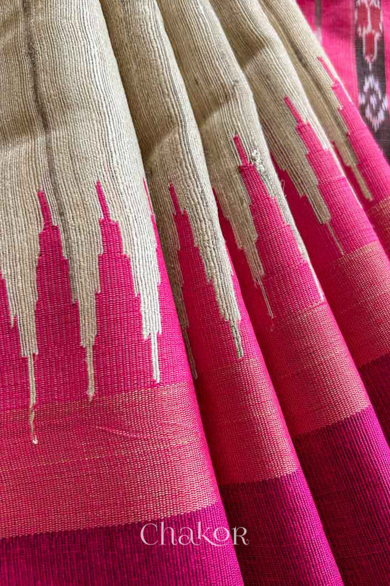 close up of a traditional pink and Natural tussar silk handloom temple border saree