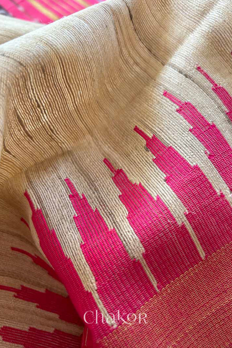close up of a traditional pink and Natural tussar silk handloom temple border saree