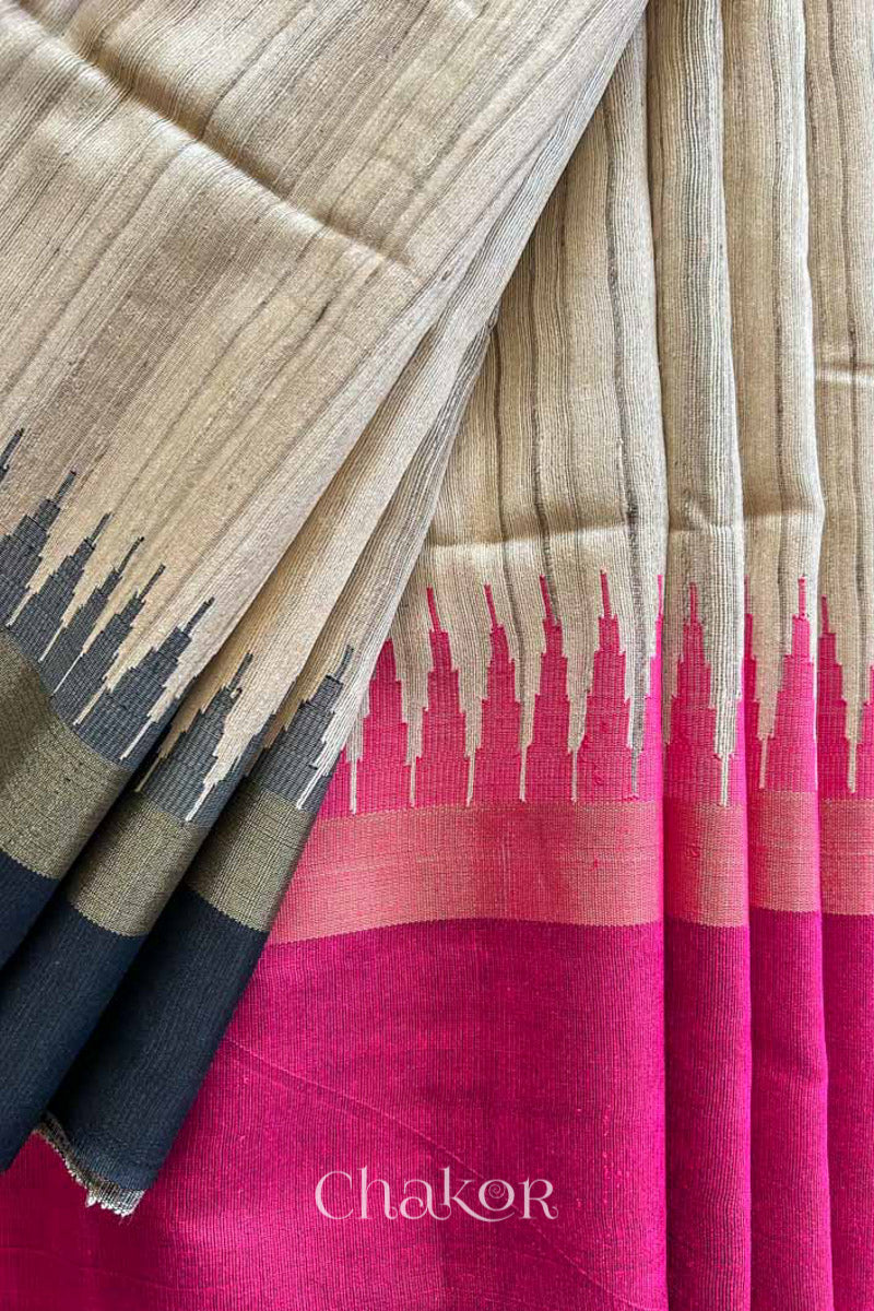 close up of a traditional pink and Natural tussar silk handloom temple border saree