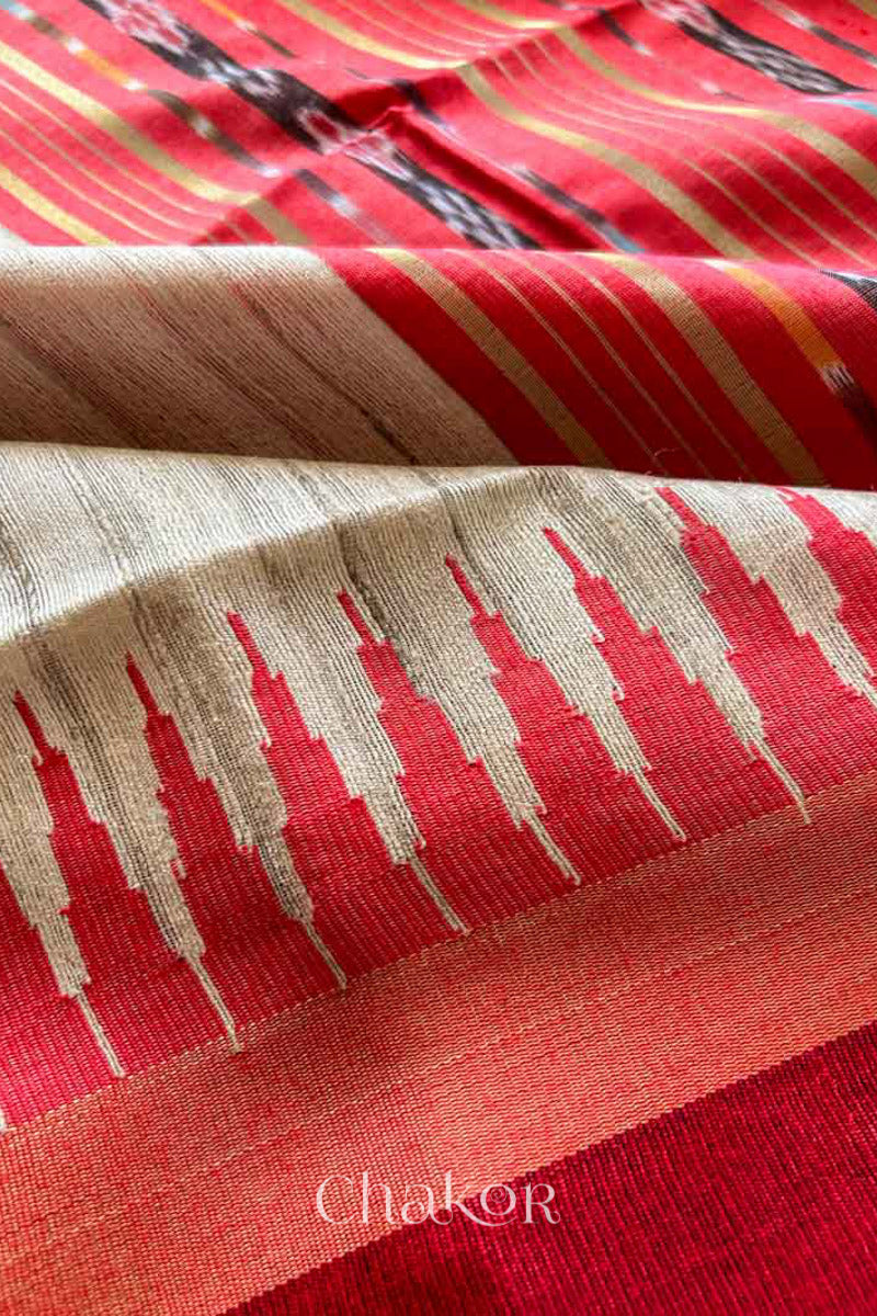 Close up of Traditional red and Natural tussar silk handloom temple border saree.