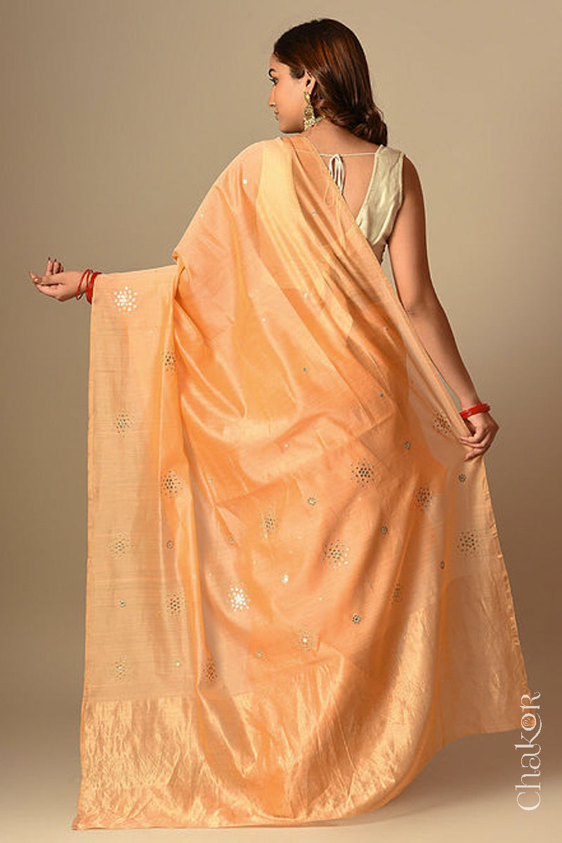 Back view of model wearing Peach Chanderi Silk Cotton Handloom Saree with sequins and mirror embroidery.
