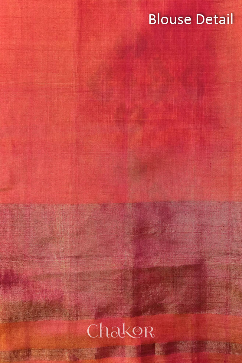 Blouse piece detail of Handloom Coral Peach Rajkoti Patola Ikat Mulberry Silk Saree with tissue borders, and pink pallu woven using traditional designs in Gujarat.