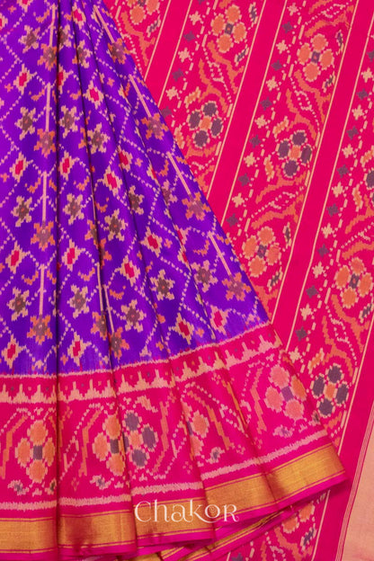 Pleats and pallu view of Handloom Purple Pink Ikat Patola Mulberry Silk Saree with traditional design.