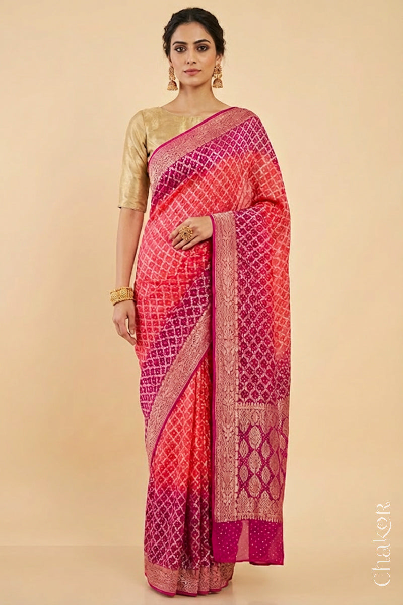 Woman wearing Handcrafted Pink and peach ombre shaded Bandhani Banarasi Georgette Silk Saree featuring zari weaving and Kutch Bandhej.