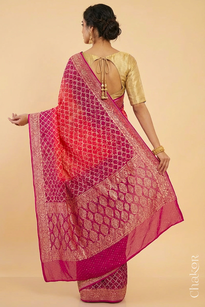Woman wearing Handcrafted Pink and peach ombre shaded Bandhani Banarasi Georgette Silk Saree featuring zari weaving and Kutch Bandhej.