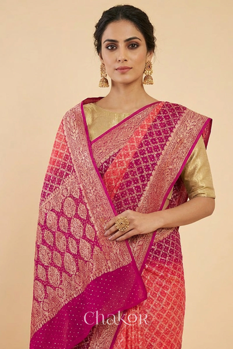 Woman wearing Handcrafted Pink and peach ombre shaded Bandhani Banarasi Georgette Silk Saree featuring zari weaving and Kutch Bandhej.