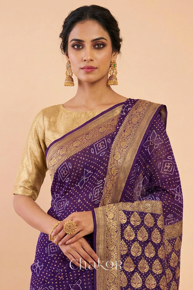 Woman wearing Handcrafted Purple Bandhani Banarasi Georgette Silk Saree featuring zari weaving and Kutch Bandhej with mirror embroidery.