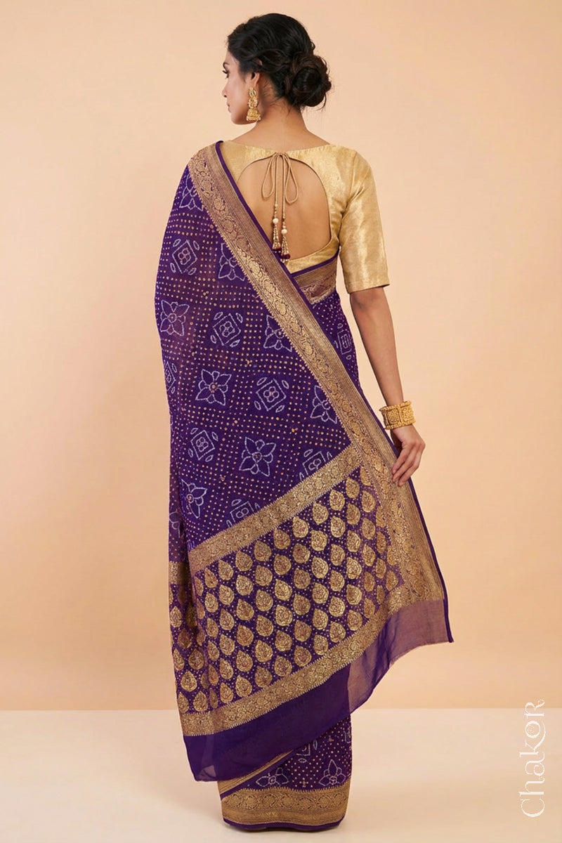 Woman wearing Handcrafted Purple Bandhani Banarasi Georgette Silk Saree featuring zari weaving and Kutch Bandhej with mirror embroidery.