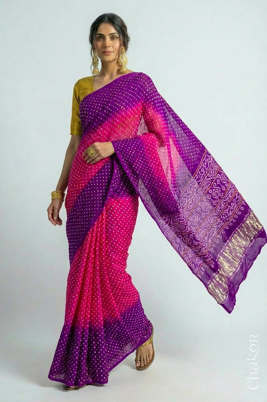 Woman wearing Handcrafted Rani pink and purple Bandhani Gaji Silk Saree with traditional rai bandhej patterns and mukaish embroidery.