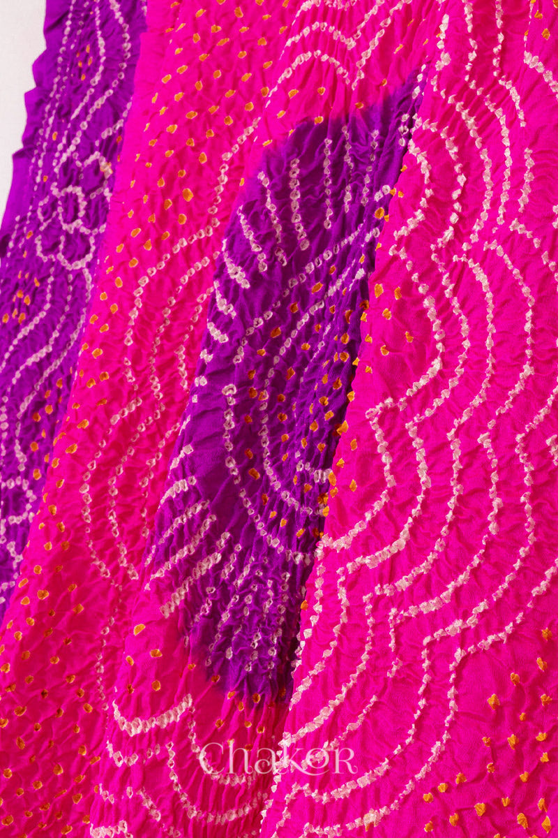 Close-up of pink and purple Bandhani tie-dye pattern on gaji silk dupatta fabric.