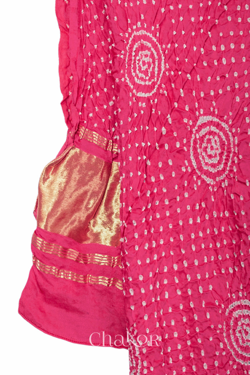 Coral Bandhani gaji silk dupatta laid flat showing circular motifs and lagdi patto pallu.