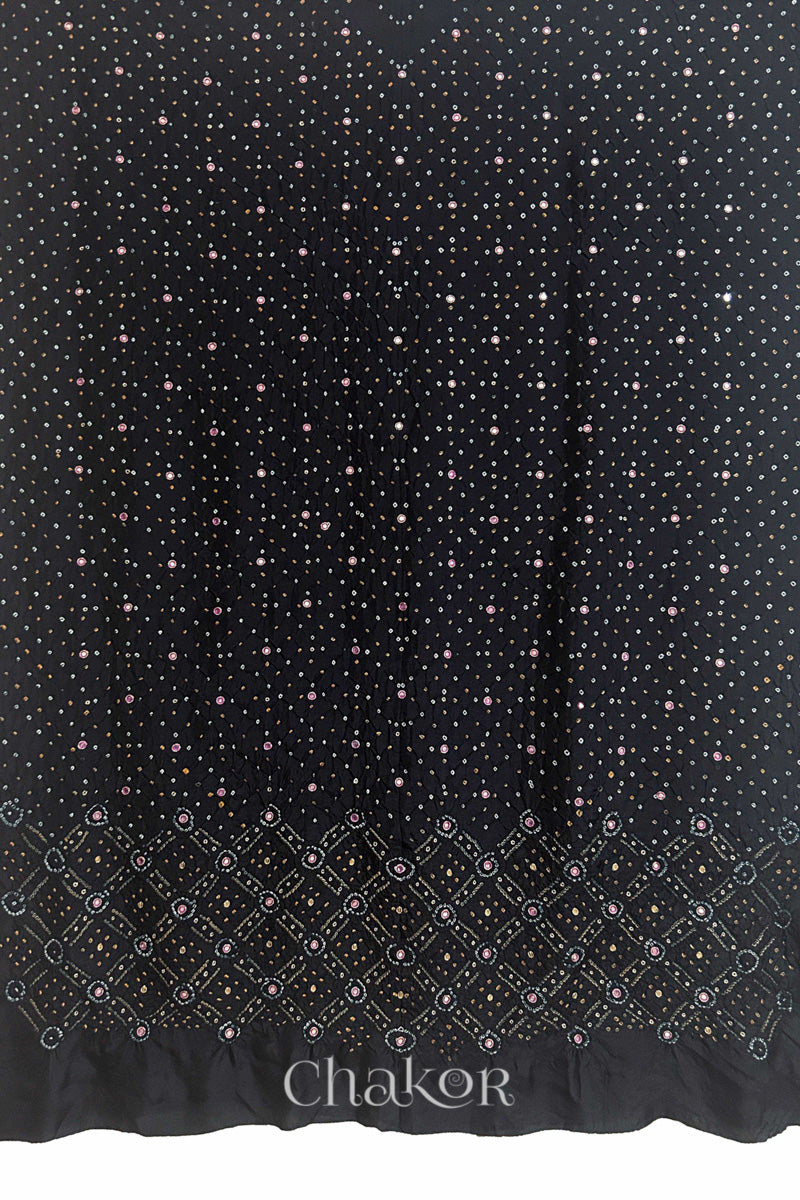 Full fabric panel of Black mulberry silk Bandhani (Rai Bandhej) with all-over white and yellow butis and a geometric border with pink with zari mirror & sequins embroidery – CHAKOR.
