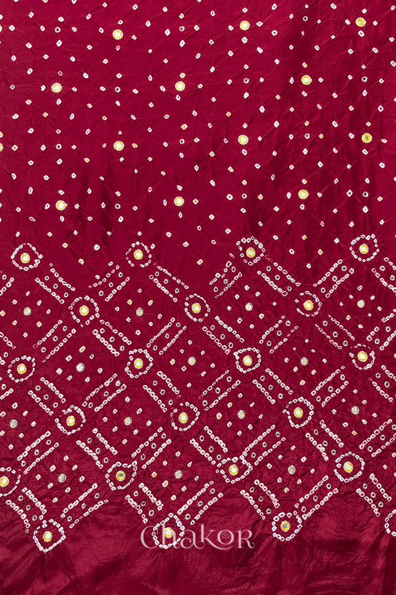 Deep Red mulberry silk Bandhani (Rai Bandhej) fabric showing full layout with white and yellow tie-dye butis, geometric bandhej pattern, and yellow with zari mirror & sequins embroidery – CHAKOR.
