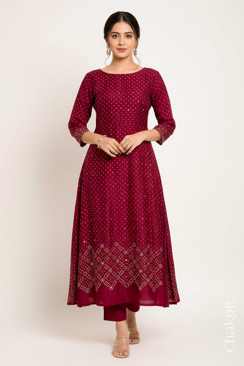Deep Red mulberry silk Bandhani (Rai Bandhej) kurta stitched from the fabric, featuring all-over white and mustard butis and a mirror-work hem border – CHAKOR