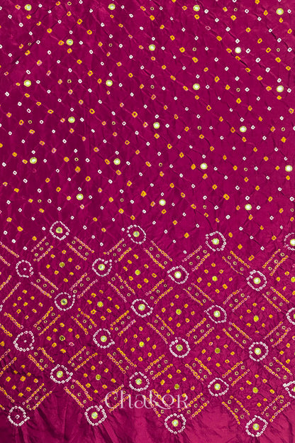 Rani Pink mulberry silk Bandhani (Rai Bandhej) fabric showing full layout with white and yellow tie-dye butis, geometric bandhej pattern, and golden zari mirror & sequins embroidery – CHAKOR.
