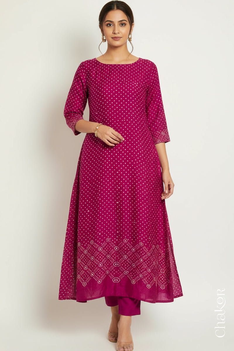Rani pink mulberry silk Bandhani (Rai Bandhej) kurta stitched from the fabric, featuring all-over white and mustard butis and a mirror-work hem border – CHAKOR