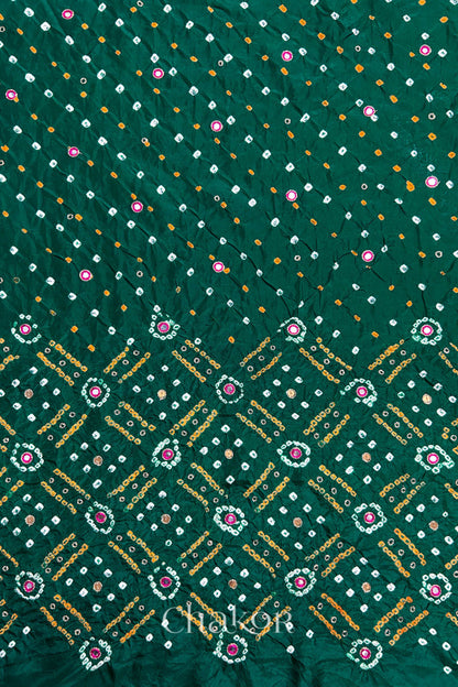 Green mulberry silk Bandhani (Rai Bandhej) fabric showing full layout with white and mustard tie-dye butis, geometric bandhej grids, and pink mirror motifs – CHAKOR.
