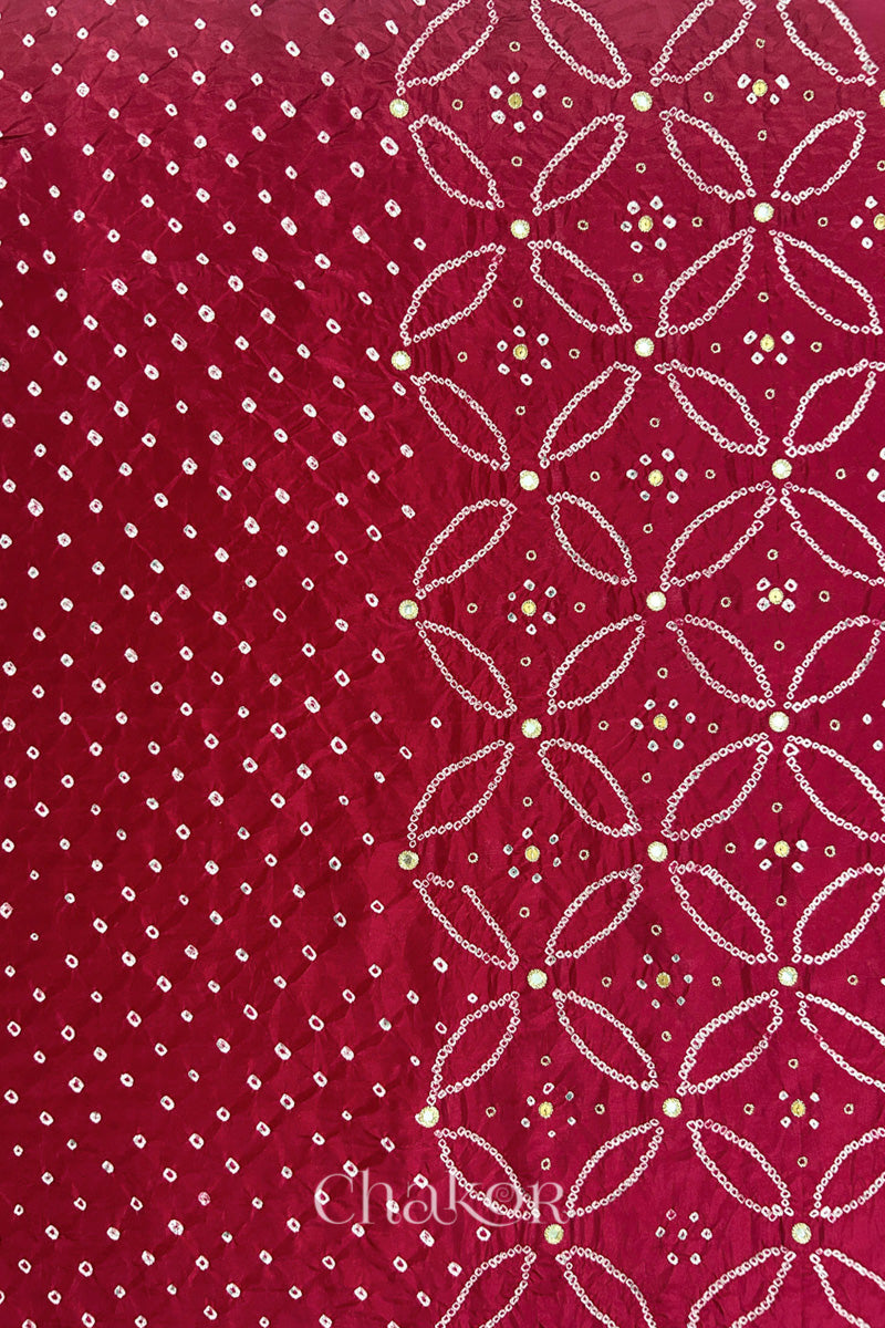 Deep Red mulberry silk Bandhani (Rai Bandhej) fabric showing full layout with white tie-dye dots, floral bandhej pattern, and golden zari mirror & sequins embroidery – CHAKOR.
