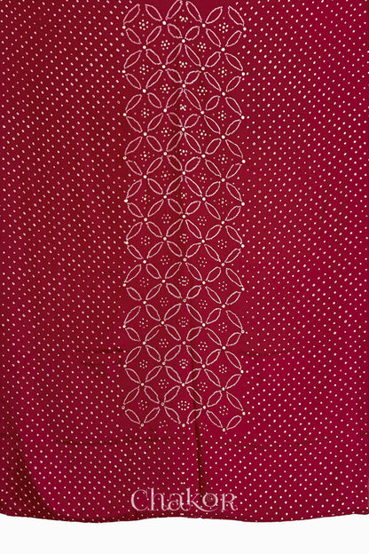 Full fabric panel of Deep Red mulberry silk Bandhani (Rai Bandhej) with all-over white dots and a floral border with golden zari mirror & sequins embroidery – CHAKOR.
