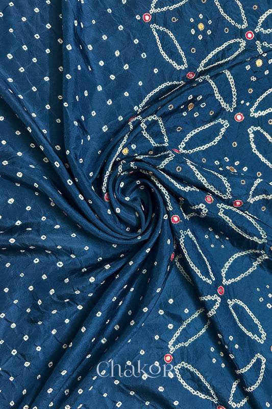 Indigo Blue mulberry silk Bandhani (Rai Bandhej) fabric with white tie-dyed motifs, pink with zari mirror and sequin embellishment, arranged in a swirling design  – CHAKOR.
