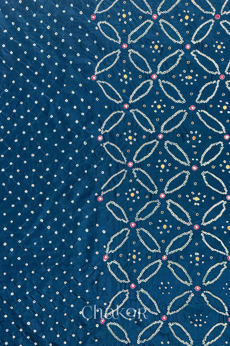 Indigo Blue mulberry silk Bandhani (Rai Bandhej) fabric showing full layout with white tie-dye dots, floral bandhej pattern, and pink with zari mirror & sequins embroidery – CHAKOR.
