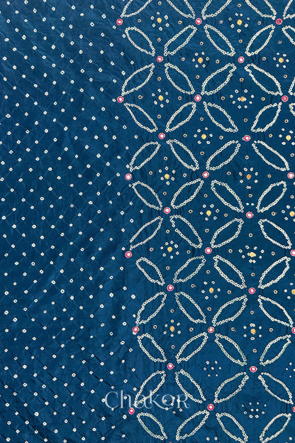 Indigo Blue mulberry silk Bandhani (Rai Bandhej) fabric showing full layout with white tie-dye dots, floral bandhej pattern, and pink with zari mirror & sequins embroidery – CHAKOR.
