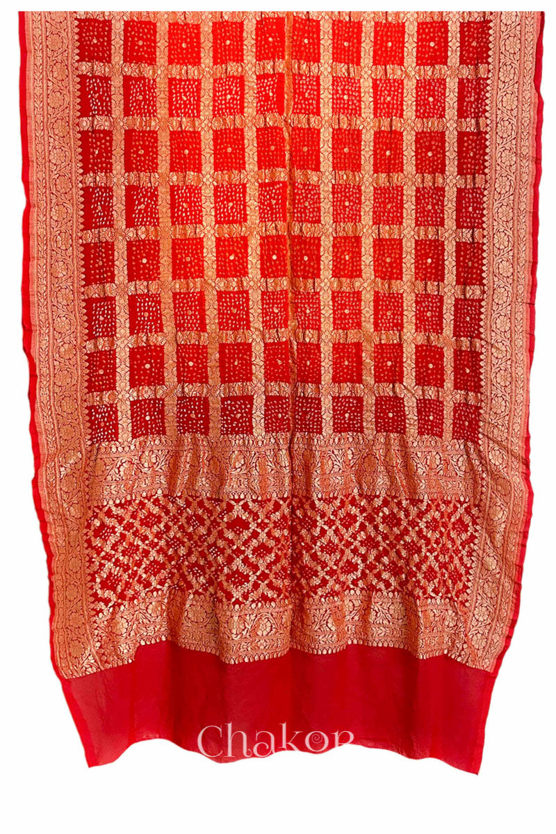 Chakor's Traditional Orange Red shaded Gharchola Bandhani Banarasi Georgette Silk Dupatta.