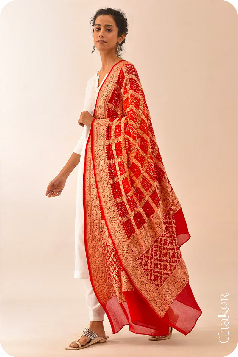 Chakor's Traditional Orange Red shaded Gharchola Bandhani Banarasi Georgette Silk Dupatta.