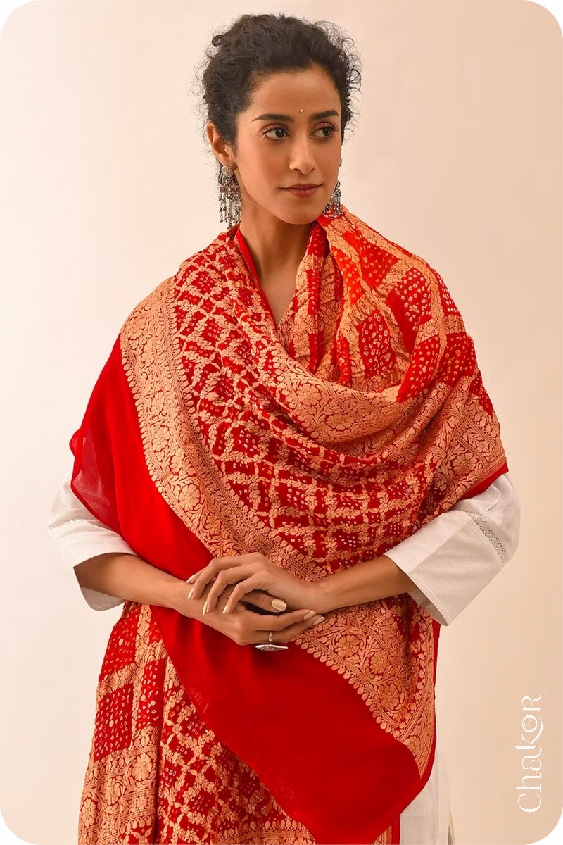 Chakor's Traditional Orange Red shaded Gharchola Bandhani Banarasi Georgette Silk Dupatta.