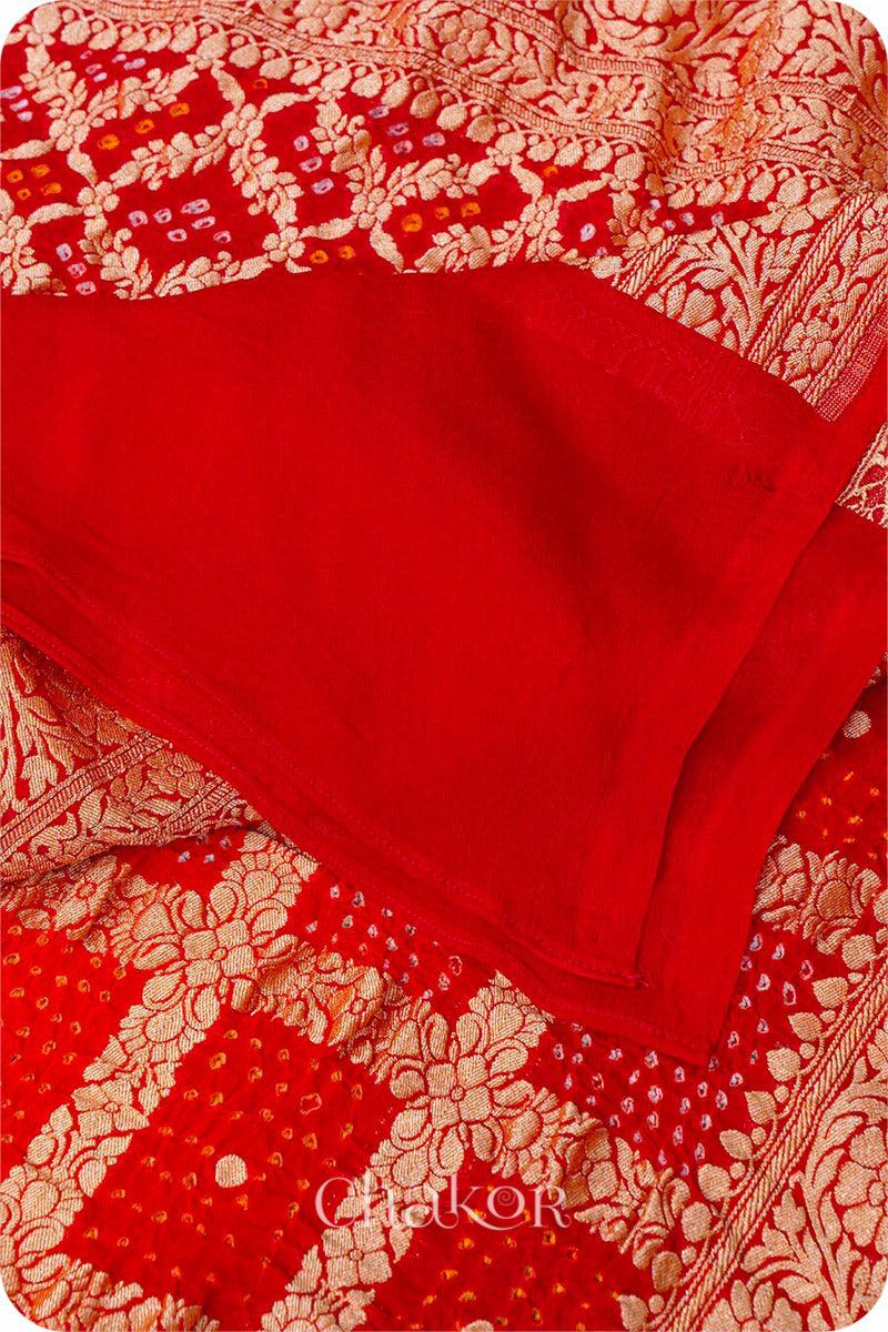 Chakor's Traditional Orange Red shaded Gharchola Bandhani Banarasi Georgette Silk Dupatta.