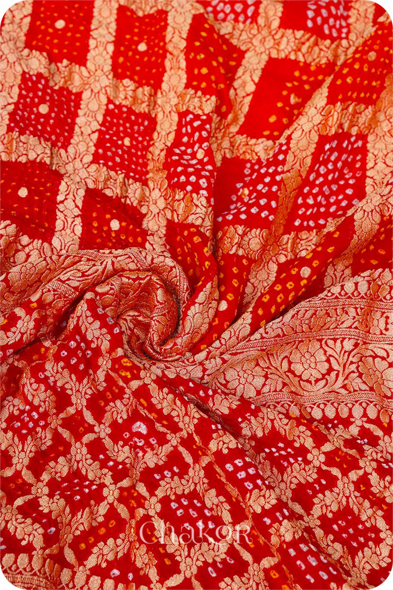 Chakor's Traditional Orange Red shaded Gharchola Bandhani Banarasi Georgette Silk Dupatta.