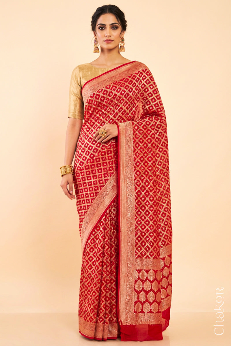 Woman wearing Handcrafted Red Bandhani Banarasi Georgette Silk Saree featuring zari weaving and Kutch rai bandhej.