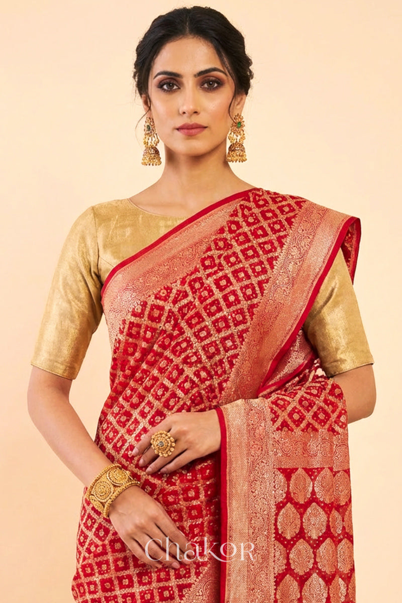 Woman wearing Handcrafted Red Bandhani Banarasi Georgette Silk Saree featuring zari weaving and Kutch rai bandhej.